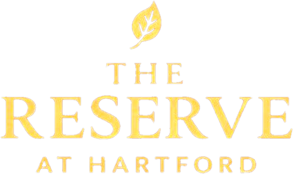 Logo for The Reserve at Hartford: gold text with a leaf above.