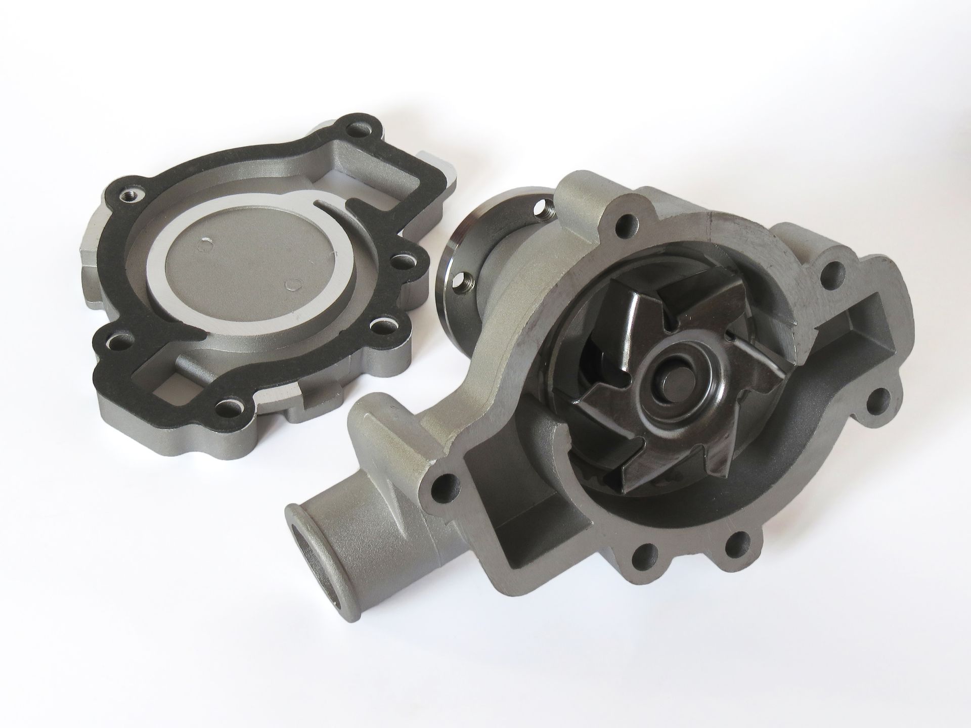 a close up of a water pump on a white surface