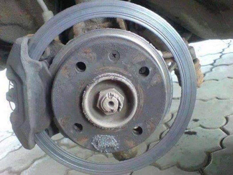a close up of a brake disc on a car .