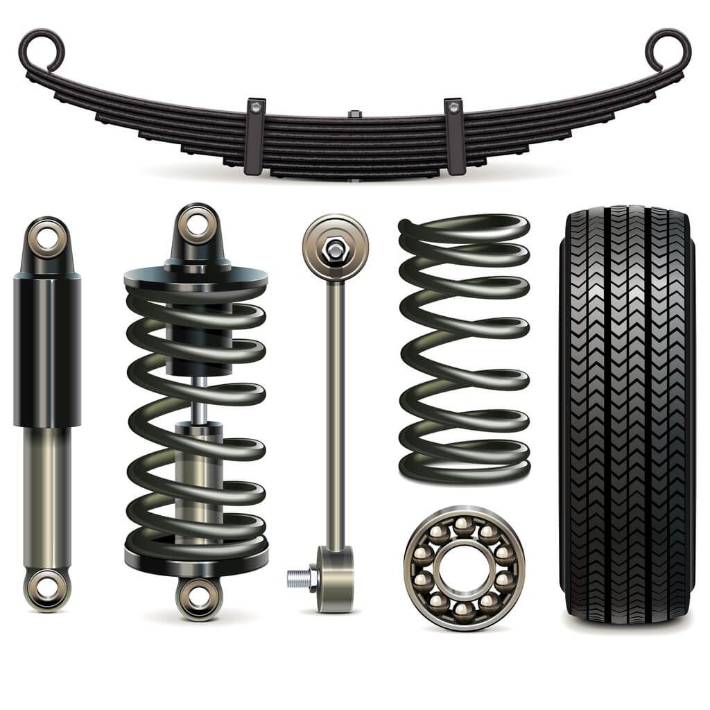a set of shock absorbers , springs , bearings and a tire on a white background .