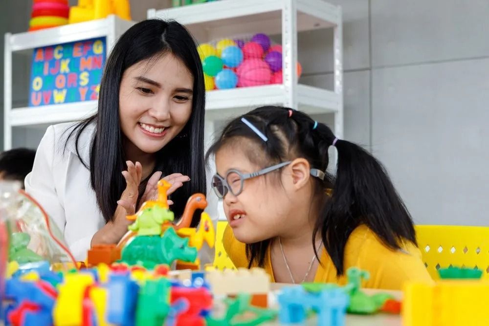 Woman and a Young Girl Playing Together