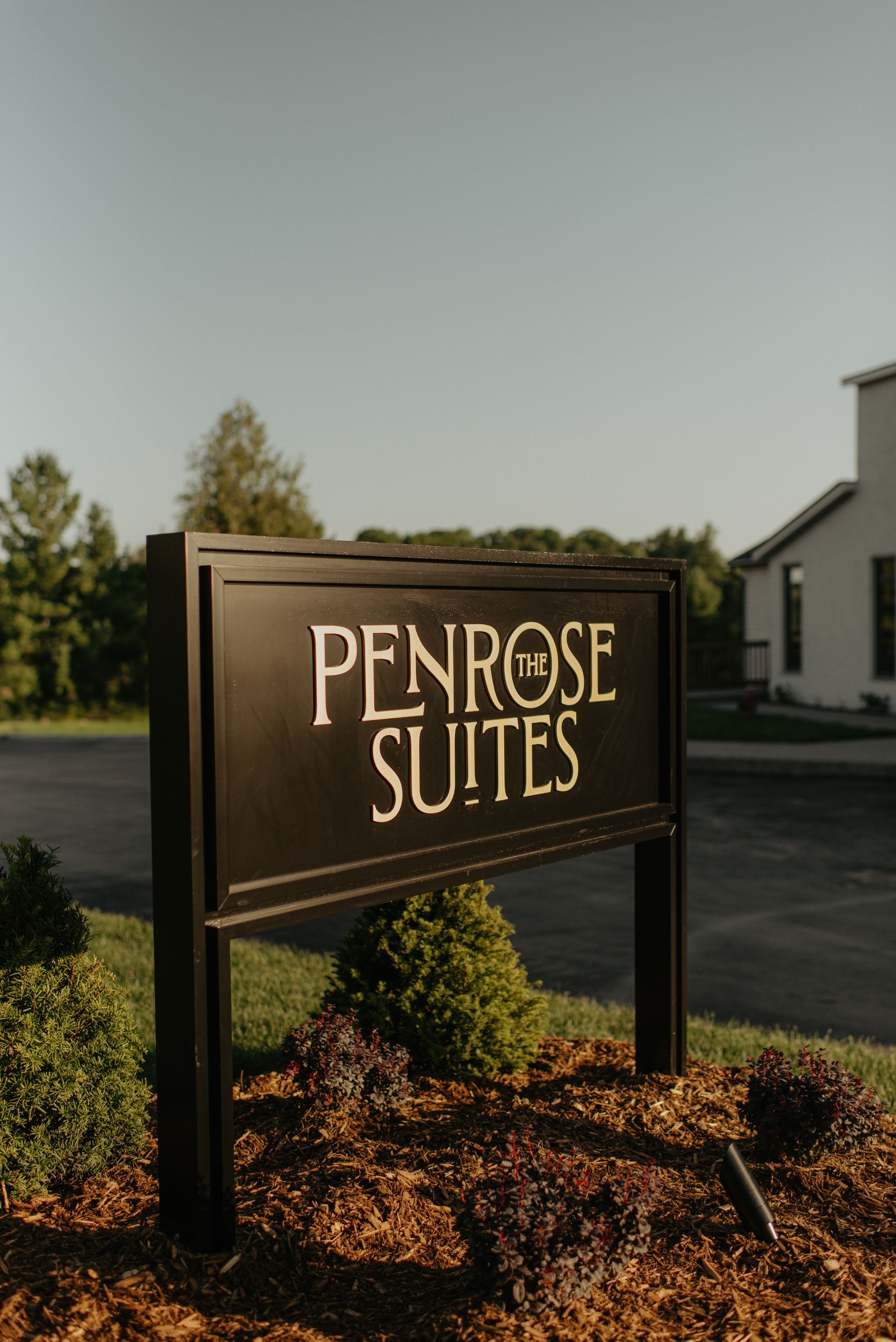 The Penrose Suites boutique hotel accommodations sign