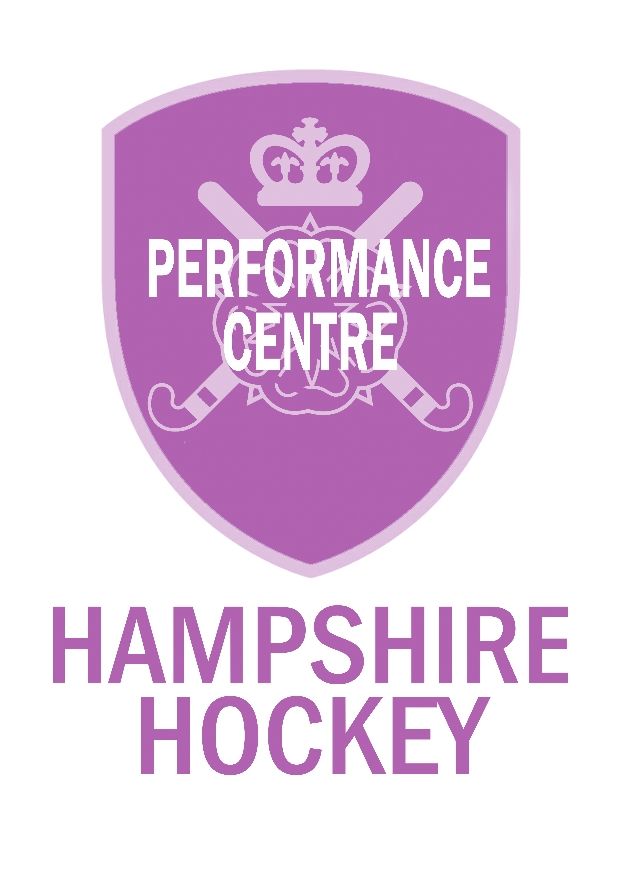 The logo for hampshire hockey is a purple shield with a crown on it.