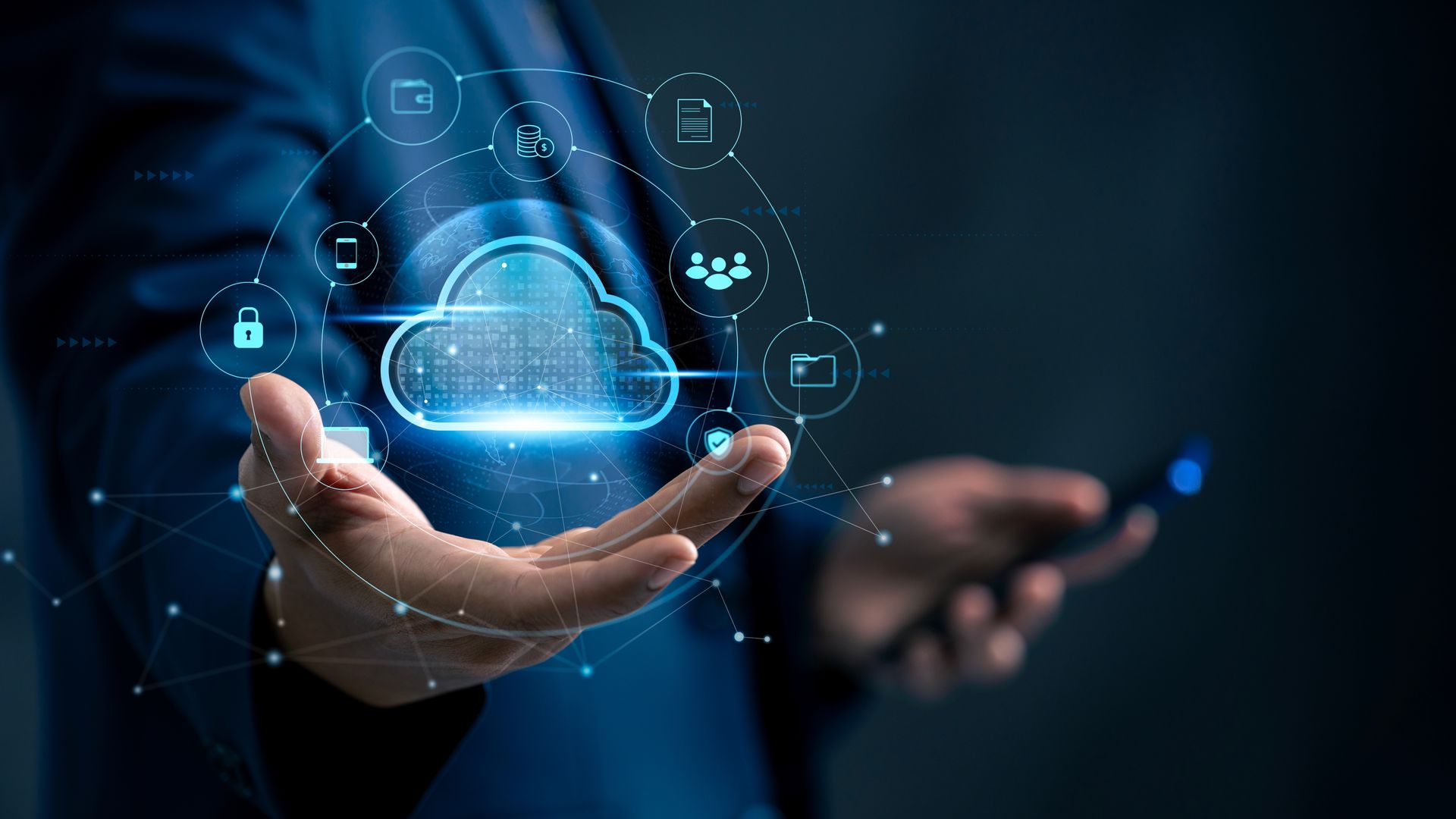 Person in suit holds illuminated cloud and digital icons, representing cloud computing and data storage.