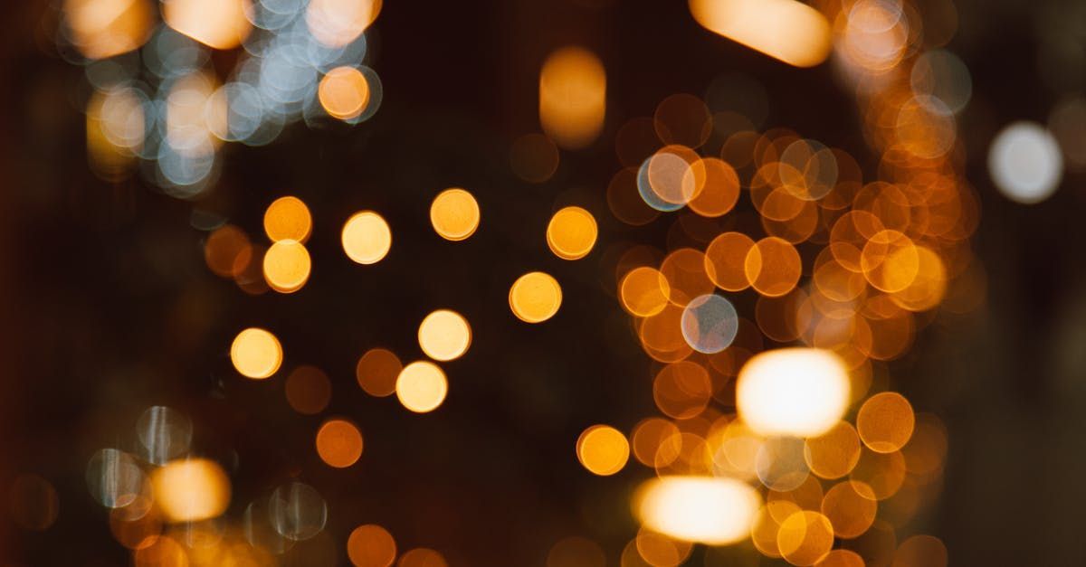 A person is holding a sparkler in their hand.