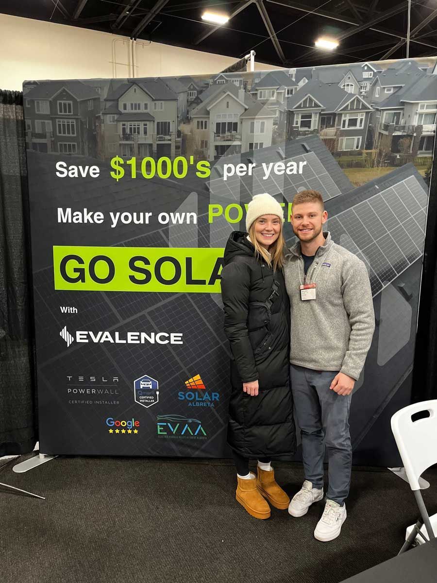 Two men in a modern kitchen are talking.