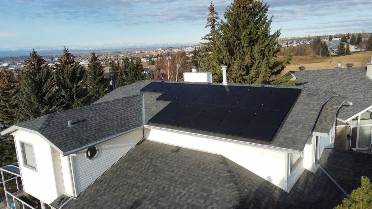 Evalence Renewables trucks parked in front of a brick building.