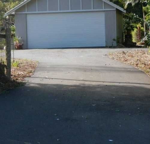 A Driveway Leading to A Garage — Roll Formed Driveways in Yandina, QLD