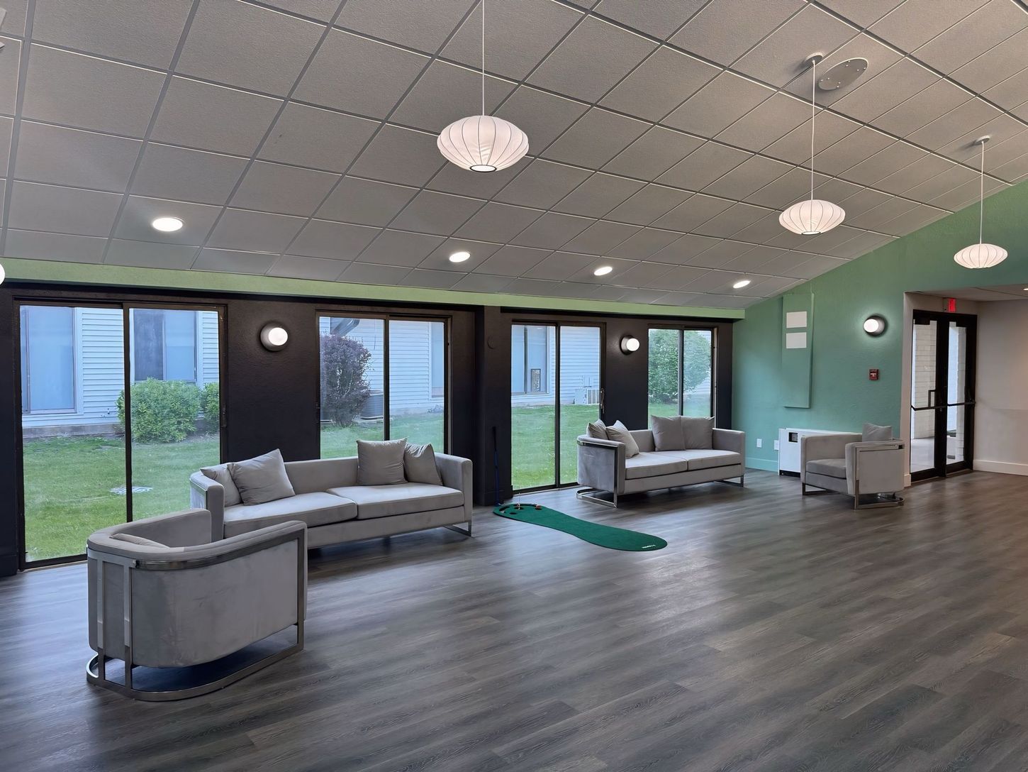 A large room with a lot of windows and furniture.