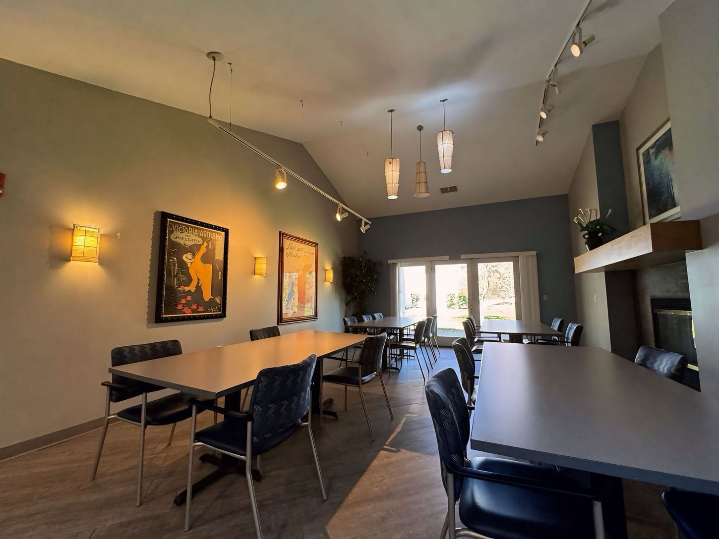 A large room with tables and chairs in it