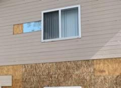 Damaged Siding Window — Milliken, CO — First Point Construction