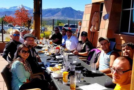Commercial Roofing — Team Eating Lunch Together in Englewood, CO