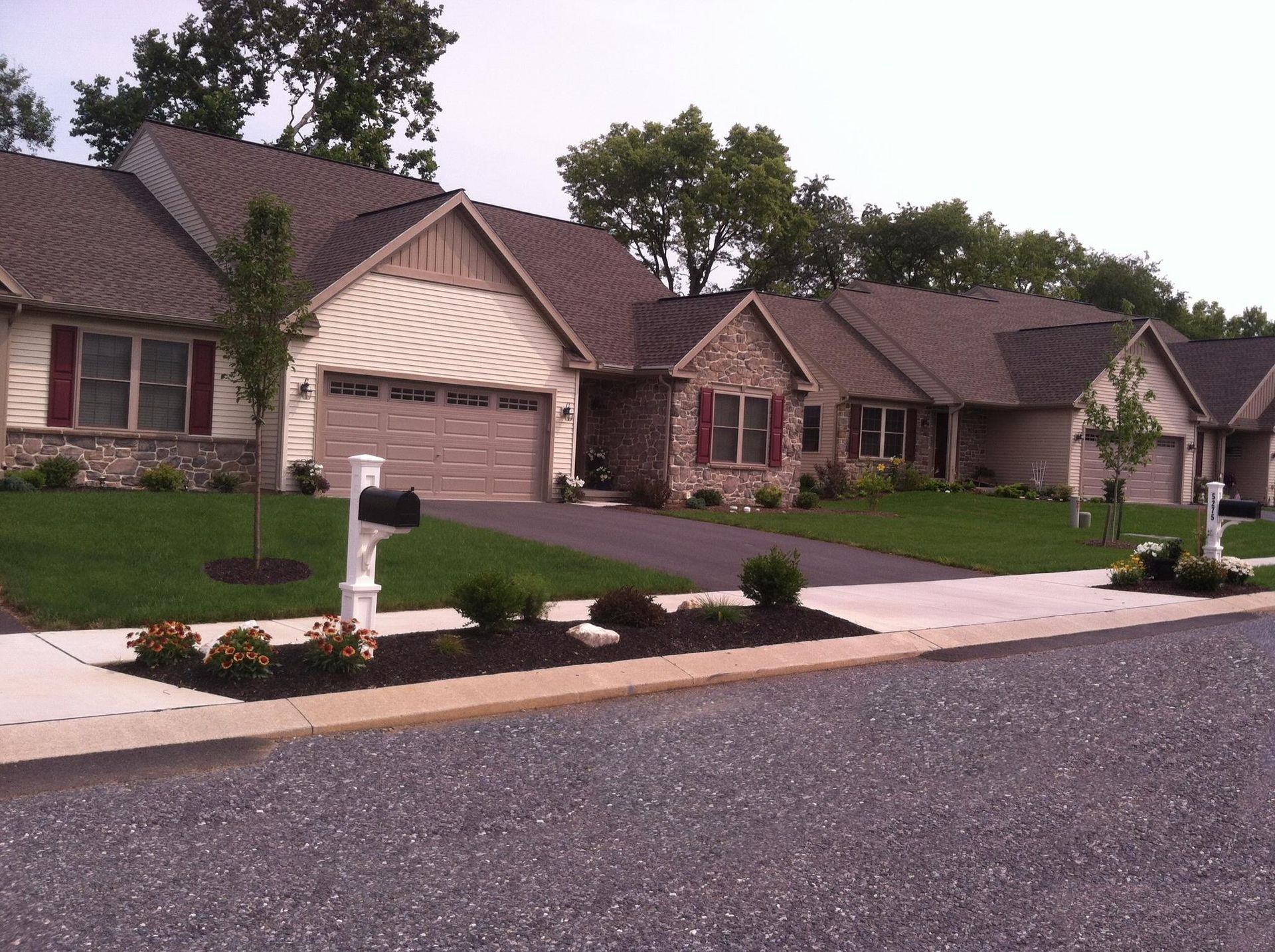 A row of houses with a mailbox in front of them