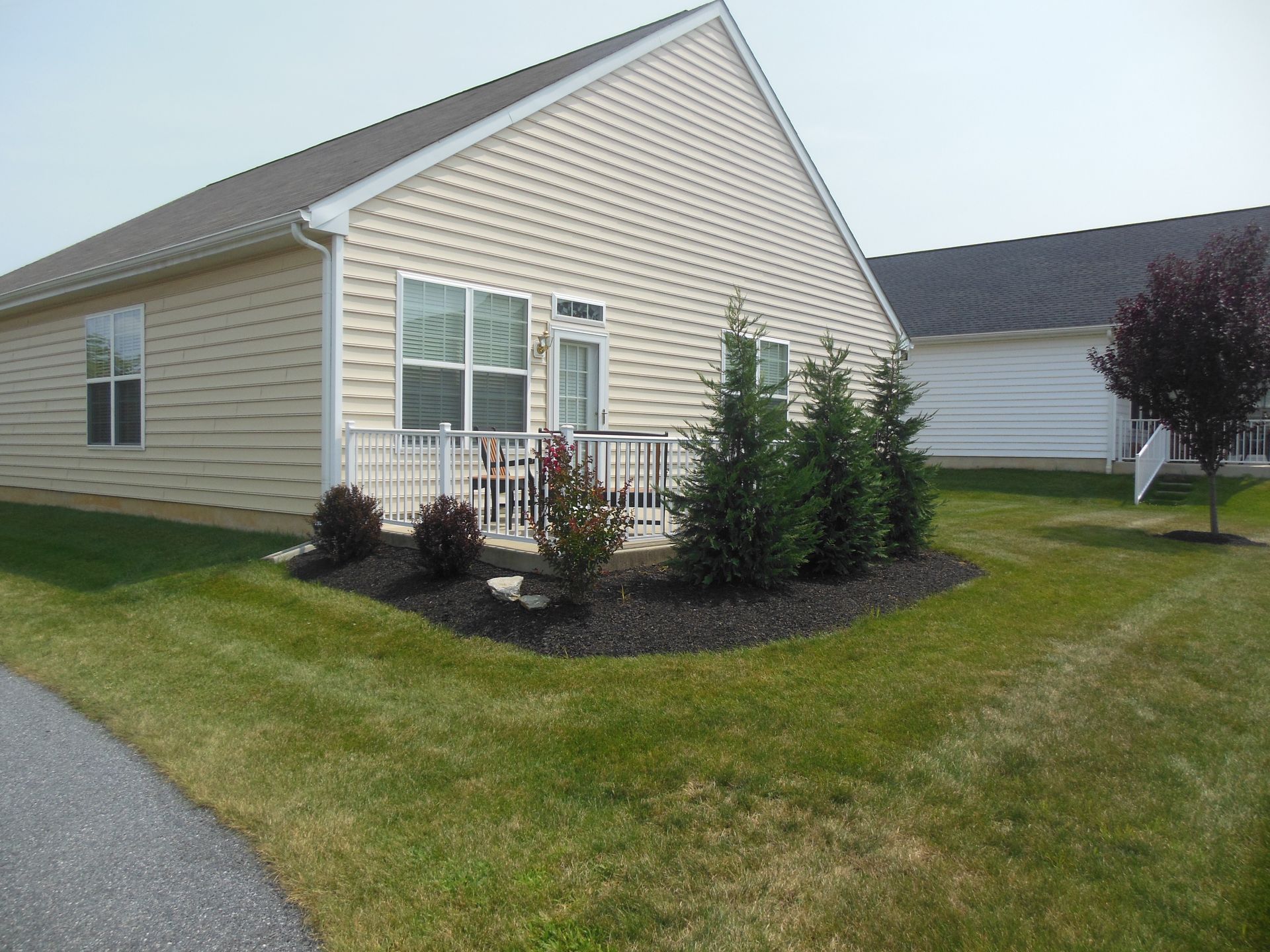 A small house with a lawn in front of it