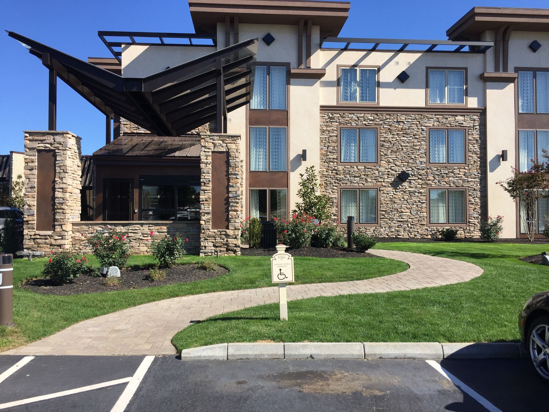 A large building with a walkway leading to it