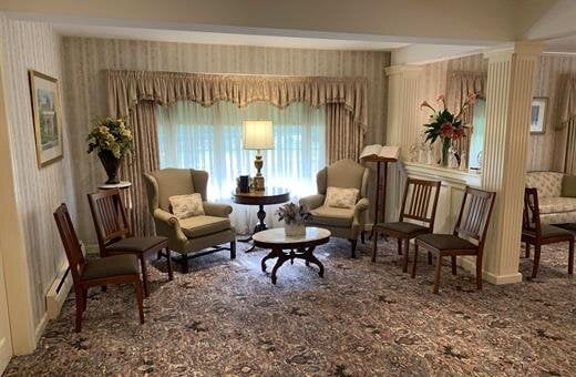 A living room filled with furniture and a table.