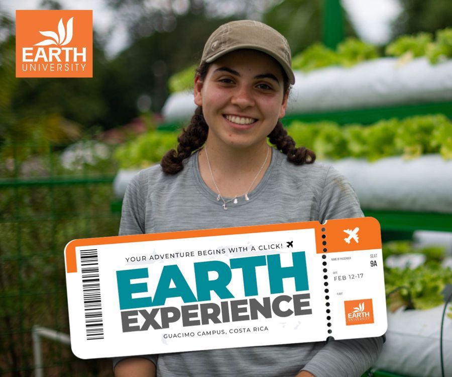 A woman is holding a sign that says earth experience