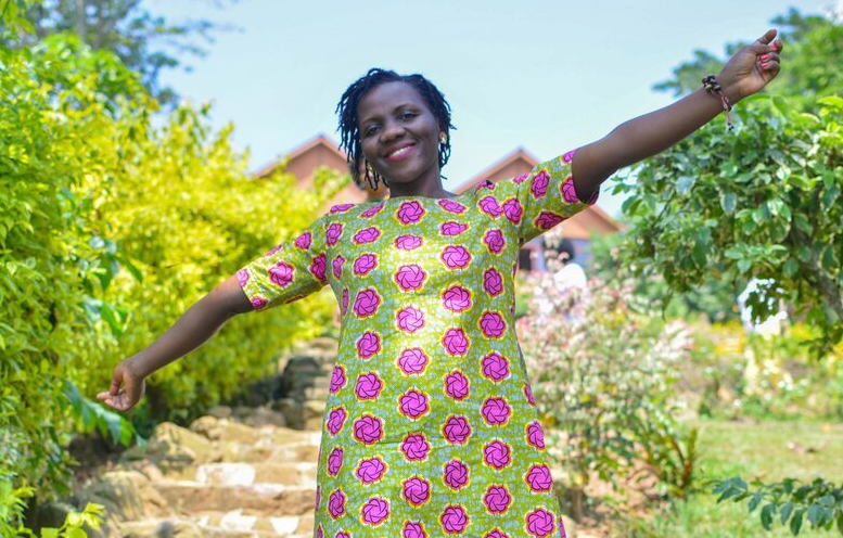 Sylvia with her arms outstretched.