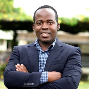 Respect is standing with his arms crossed.