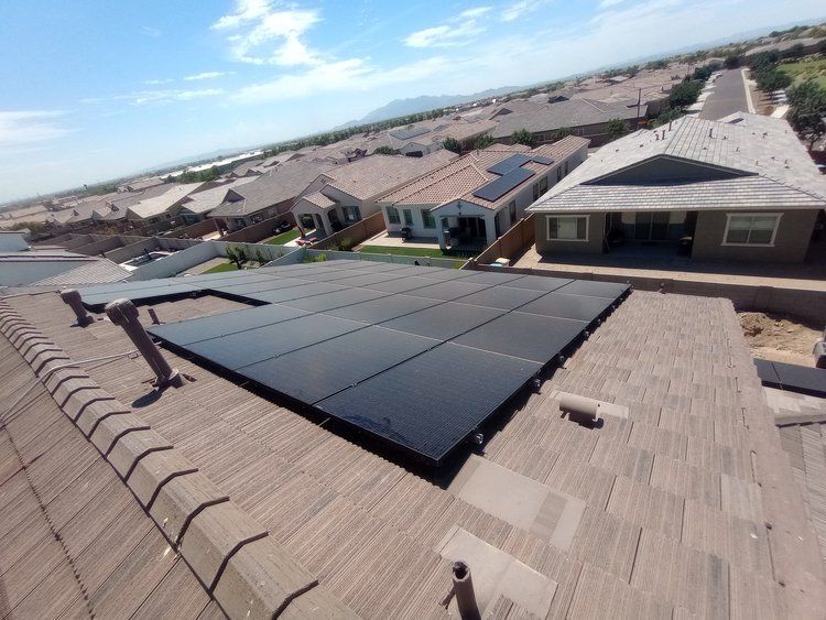 An aerial view of a roof with solar panels on it