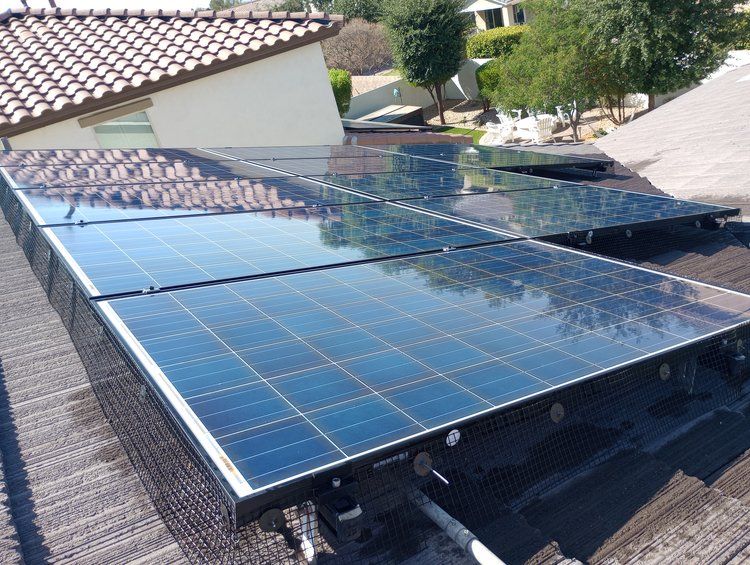A row of solar panels on the roof of a house