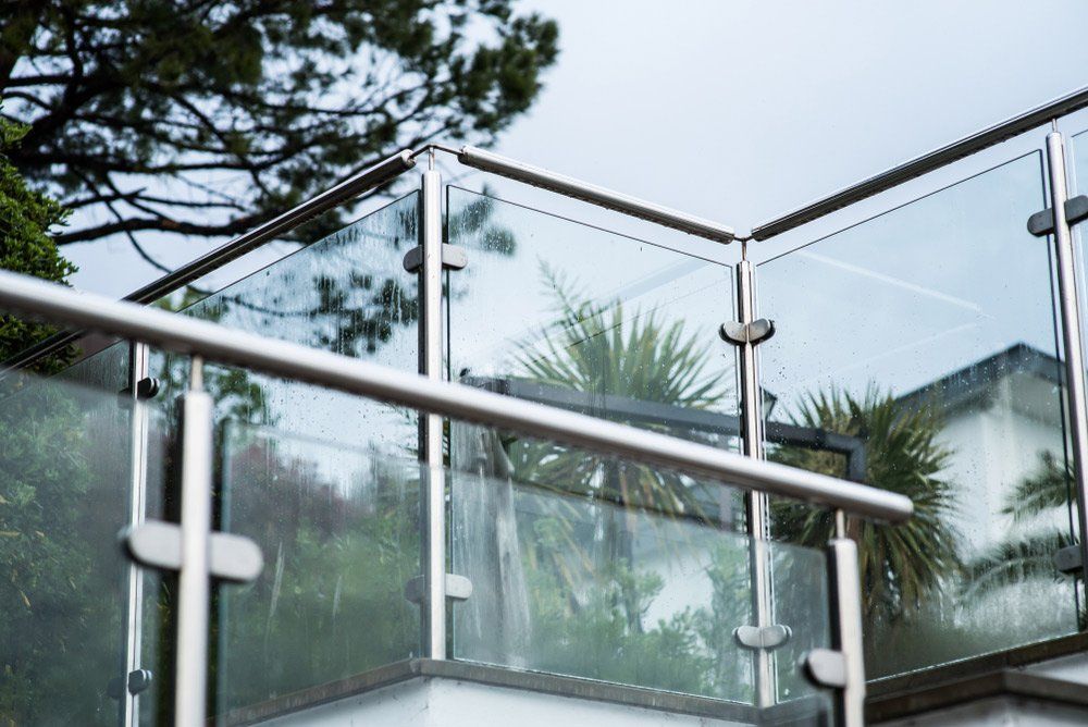 Metal Railings and Glass Wall Outdoor — Gates & Fencing in Coffs Harbour, NSW
