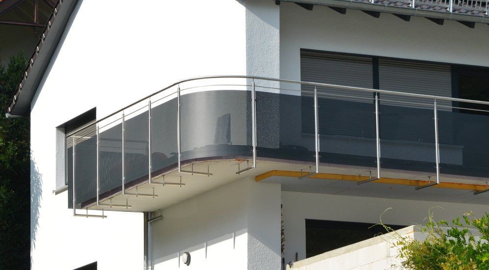 Modern Metal Balcony With Rounded Handrail — Gates & Fencing in Coffs Harbour, NSW