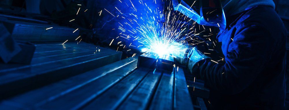 Welder Works With a Metal Profile — Gates & Fencing in Coffs Harbour, NSW