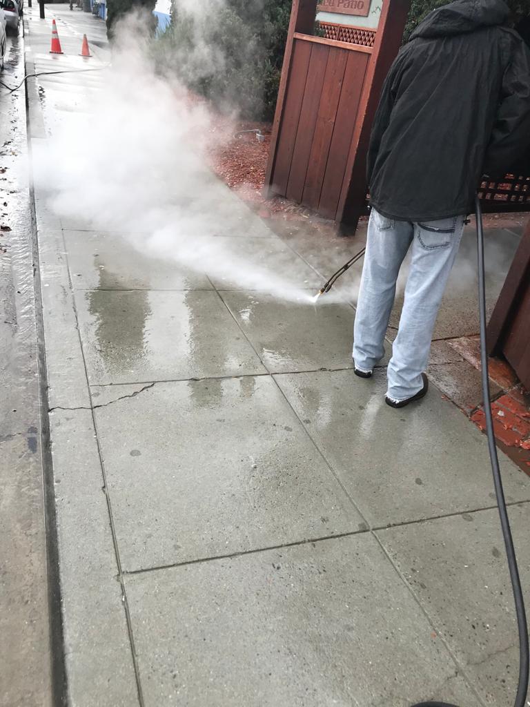Man Holding Pressure Washer — Belmont, CA — ASG Complete Landscape