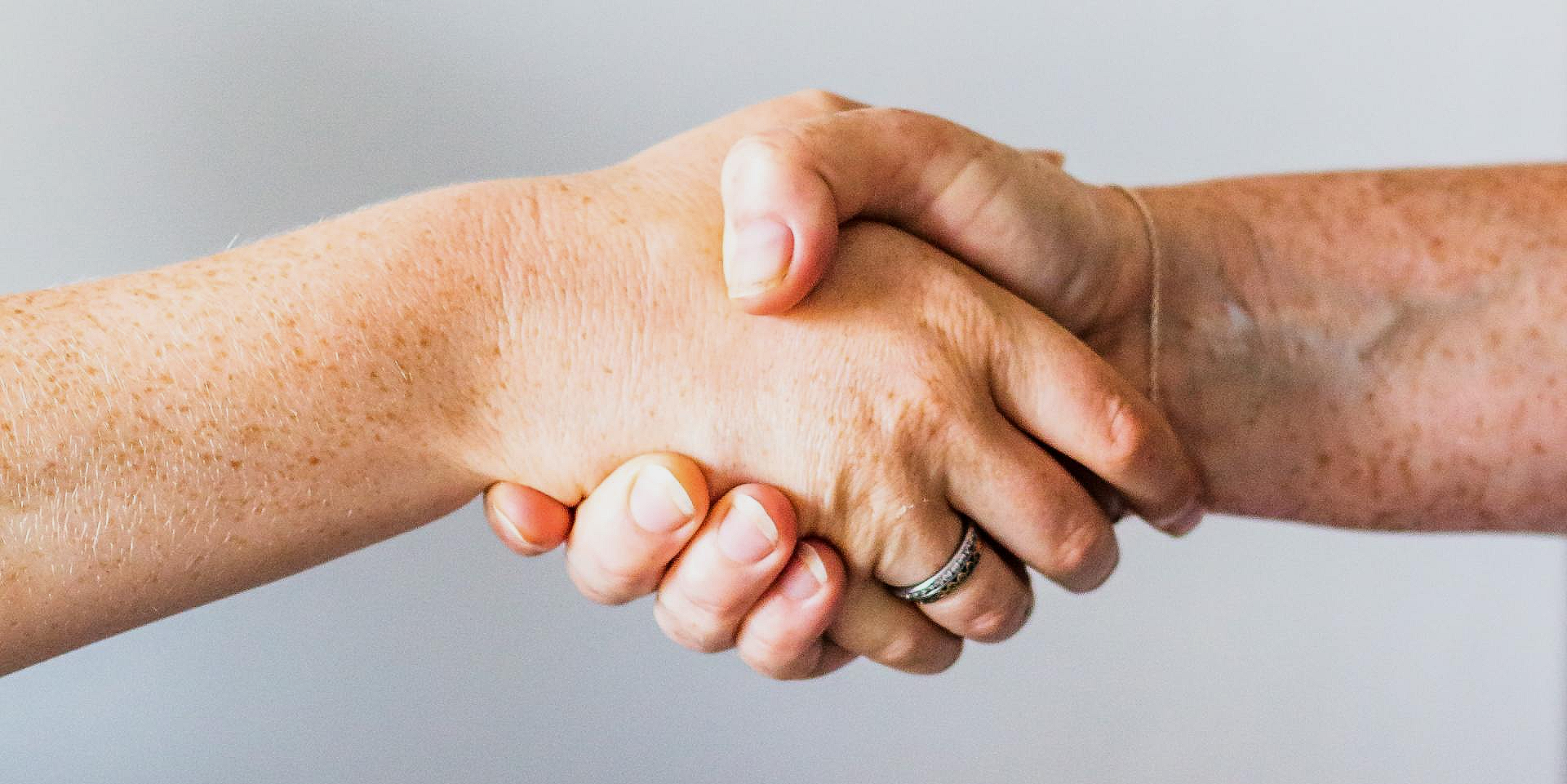 Image of two hands shaking-hands