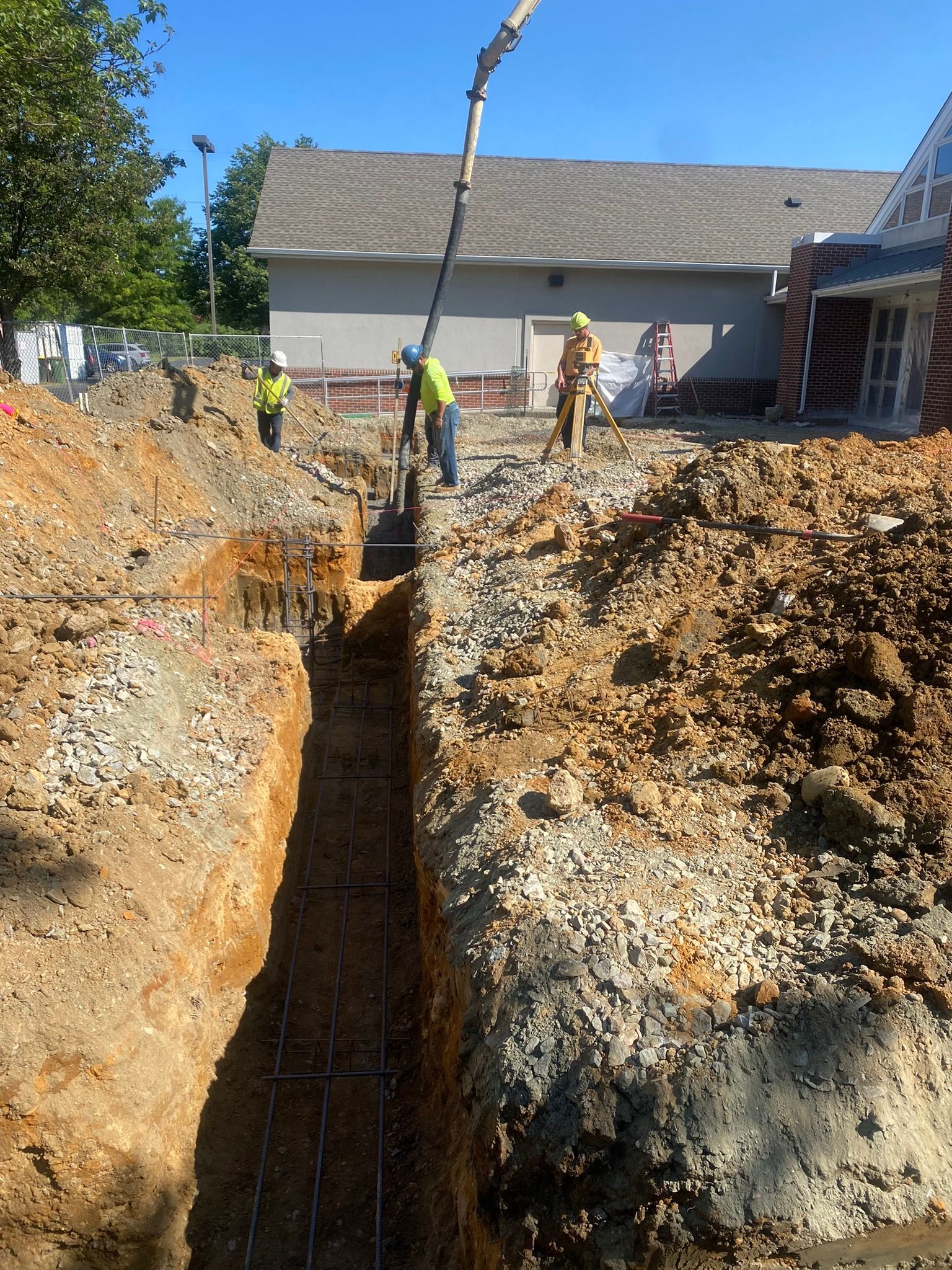 a group of construction workers are working on a construction site .
