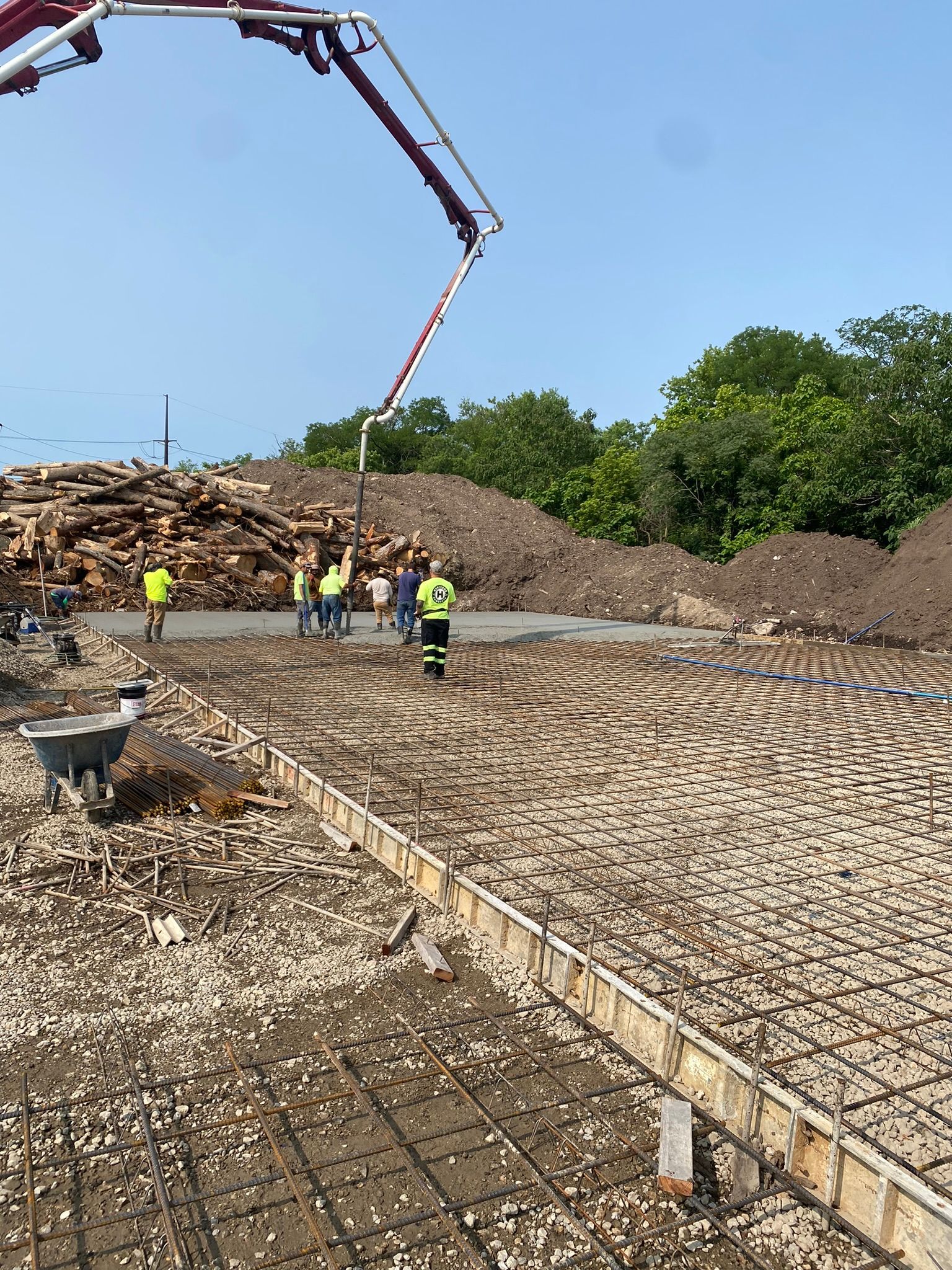 a group of construction workers are working on a construction site .