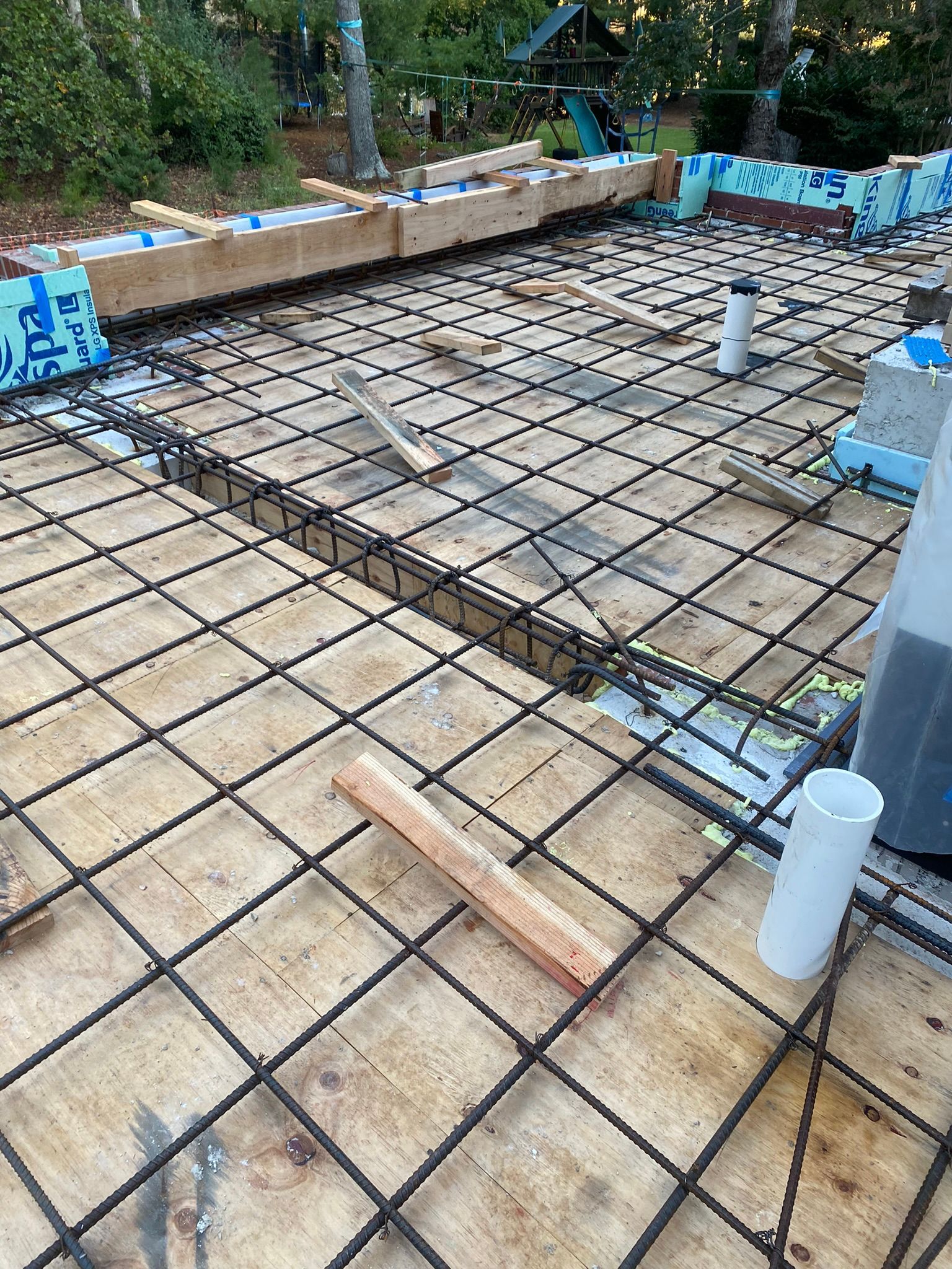 a concrete foundation is being built for a commercial property.