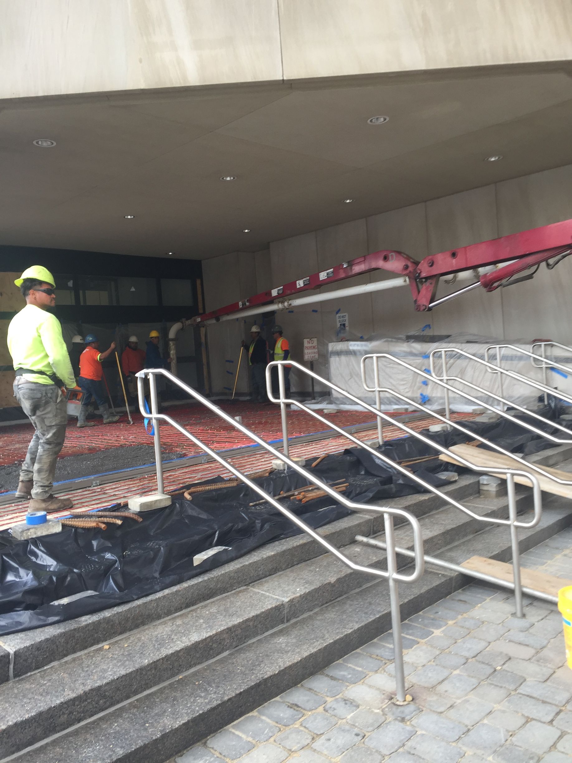 construction crew working on laying out the foundation for stamped concrete decking