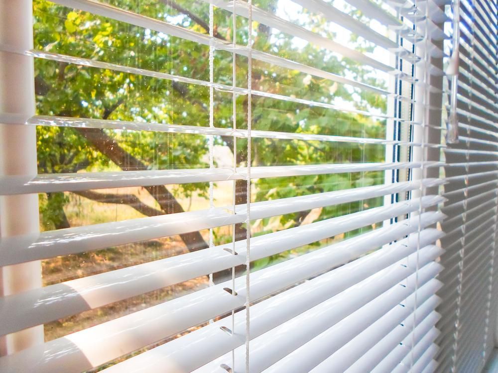 A White Awning Is Covering a Balcony with A White Railing — Mi-ekka Designs in Cannonvale, QLD