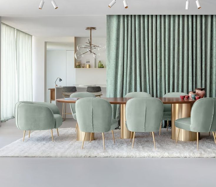 A Dining Room With a Table and Chairs and a Rug — Mi-ekka Designs in Airlie Beach, QLD
