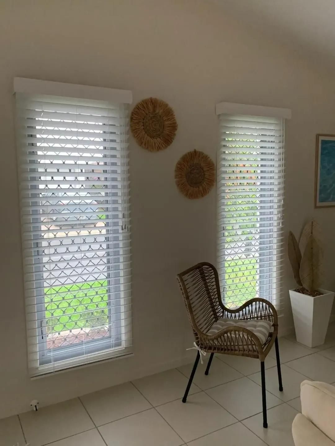 A Living Room With Two Windows , a Chair and a Couch — Mi-ekka Designs in Proserpine, QLD