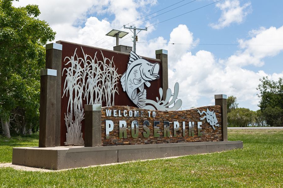 A Tropical Beach with Palm Trees and Mountains in The Background — Mi-ekka Designs in Proserpine, QLD