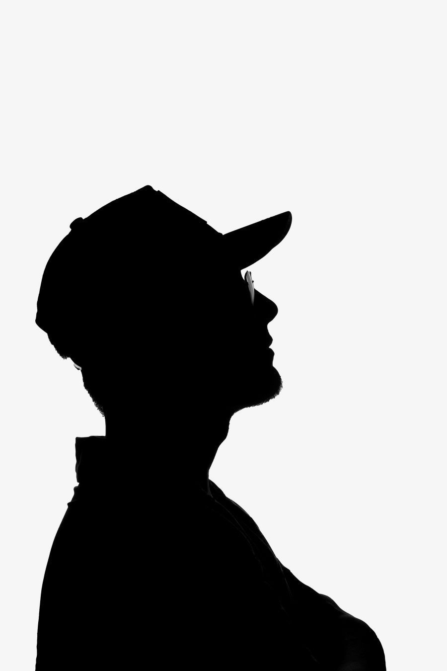 Silhouette of man in ball cap