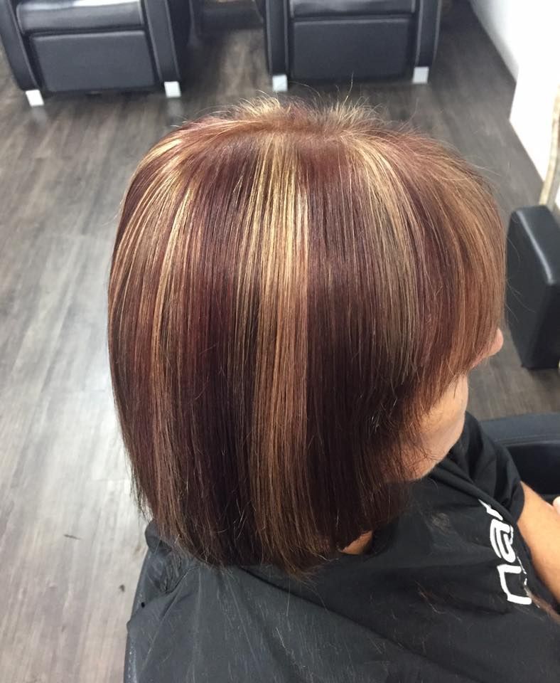 A Woman Is Sitting In A Chair With Her Hair Cut In A Salon — Cut Loose Haircare Outlet in Evans Head, NSW