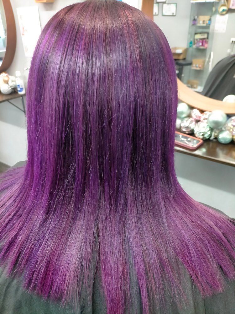 A Woman With Purple Hair Is Getting Her Hair Cut In A Salon — Cut Loose Haircare Outlet In Byron Bay, NSW