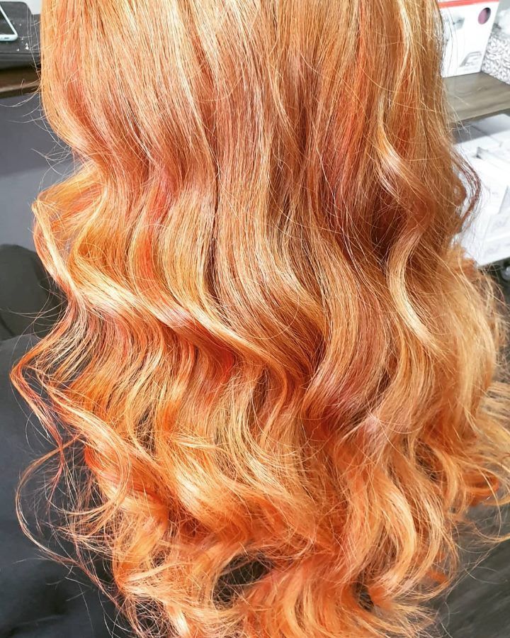 A Close Up Of A Woman 's Long Wavy Red Hair — Cut Loose Haircare Outlet In Lismore, NSW
