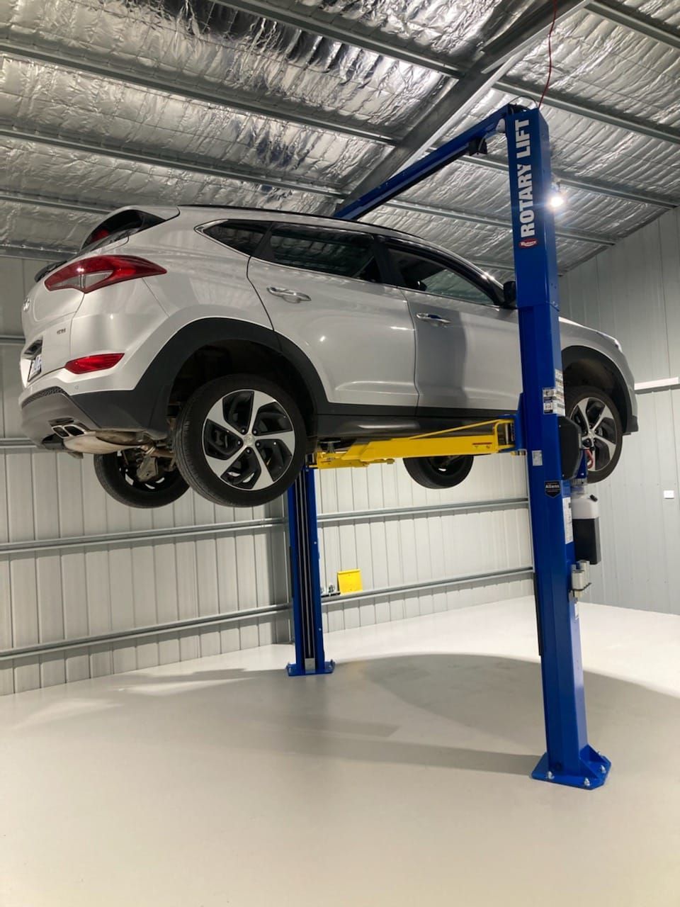 car installing on 2 pot at top