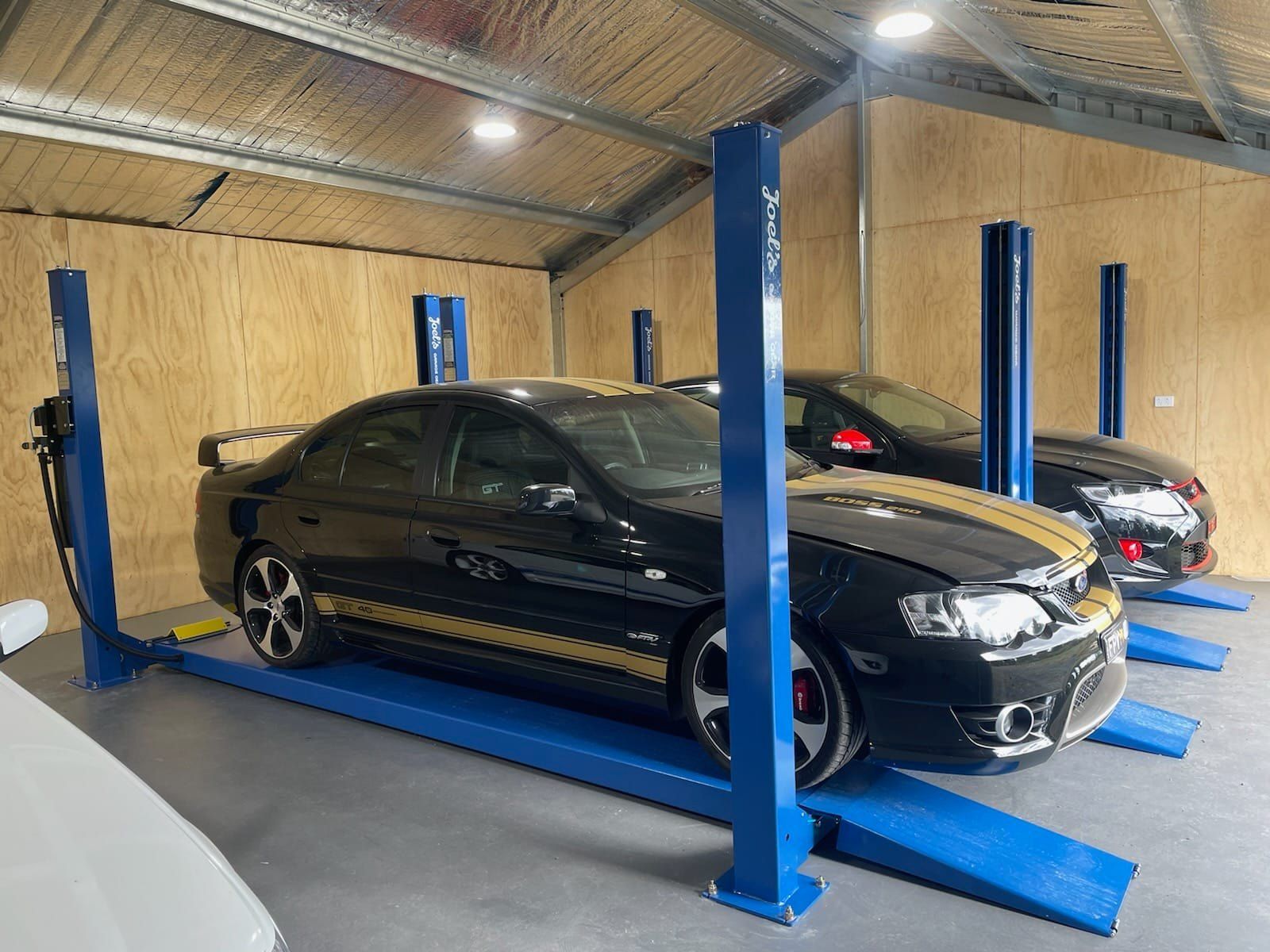 black car installing on pot