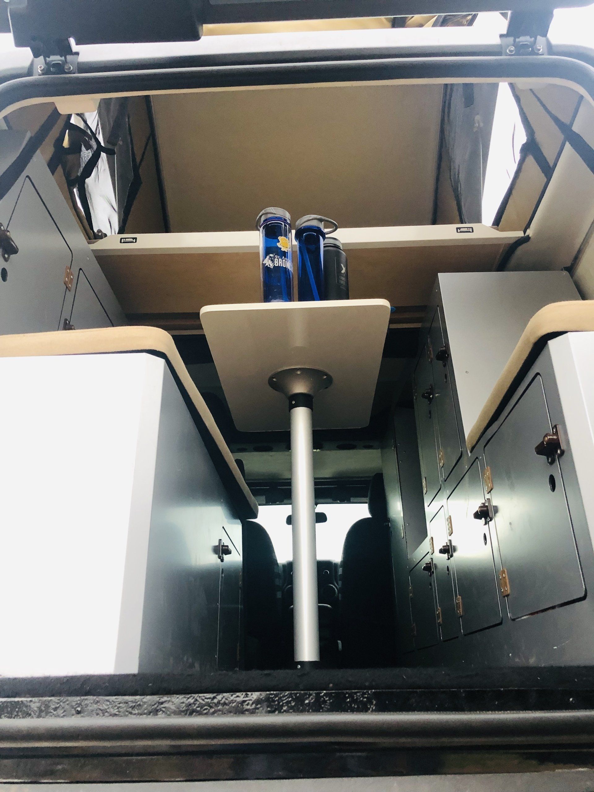 The table and cargo boxes in the back of an American Safari JXL