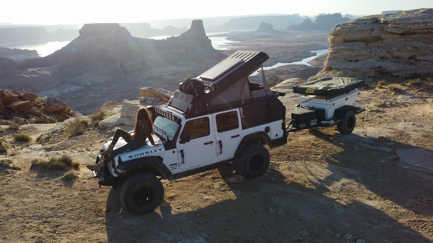 An American Safari JXL with the tent up and a cargo trailer behind it. 