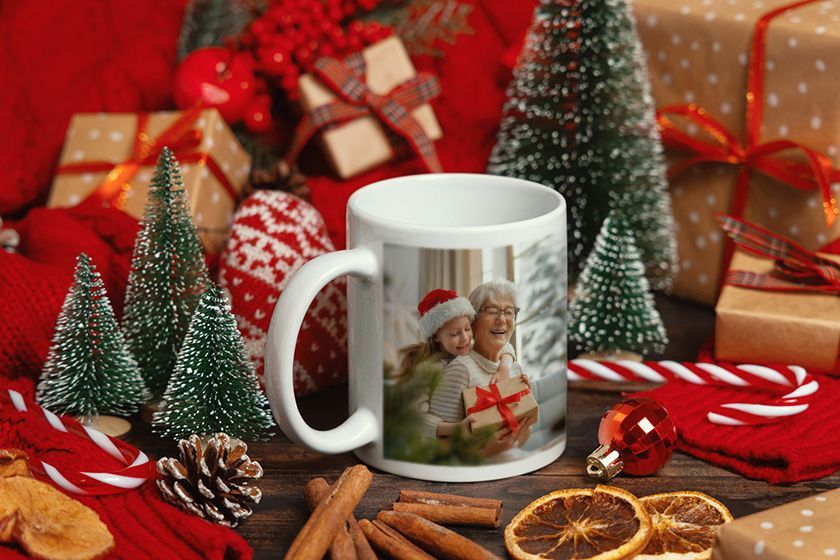 A white coffee mug with a picture of a man and a woman on it
