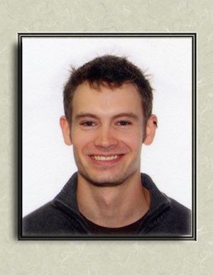 A picture of a smiling man in a frame