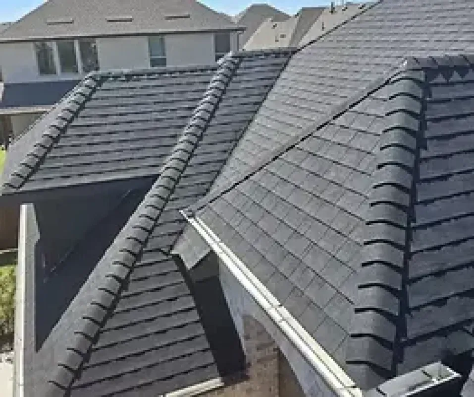 A roof of a house with a lot of tiles on it.