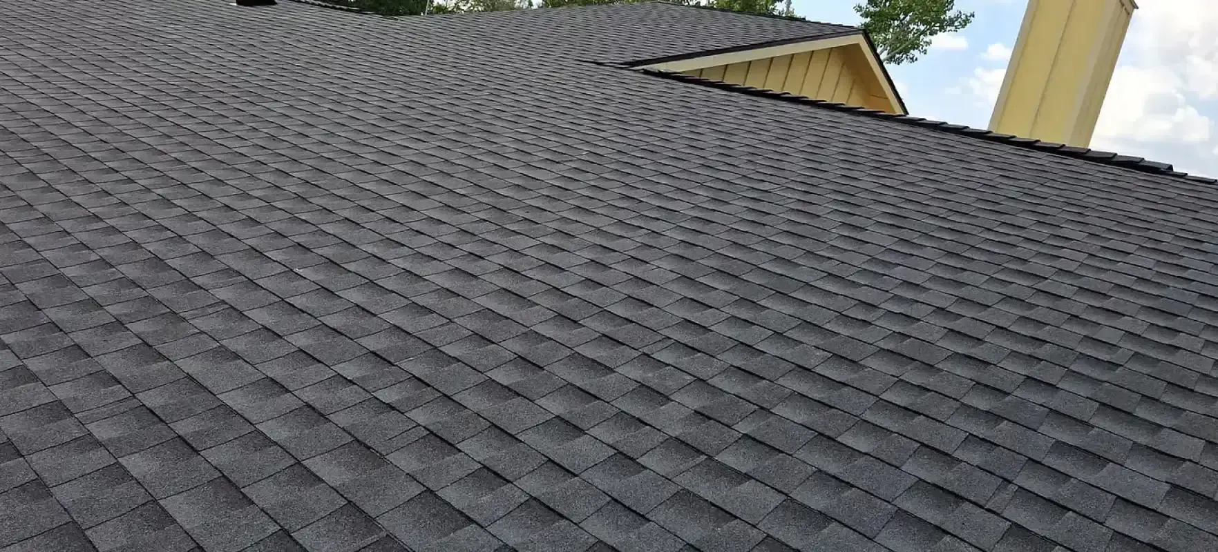 A close up of a roof with shingles on it.